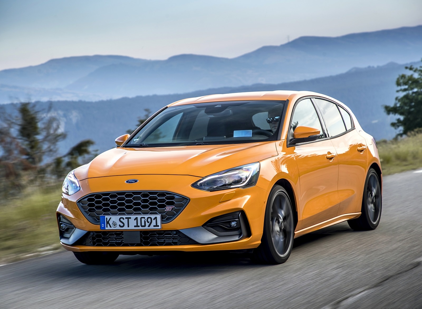 2019 Ford Focus ST (Euro-Spec Color: Orange Fury) Front Three-Quarter Wallpapers (1). Download Wallpaper