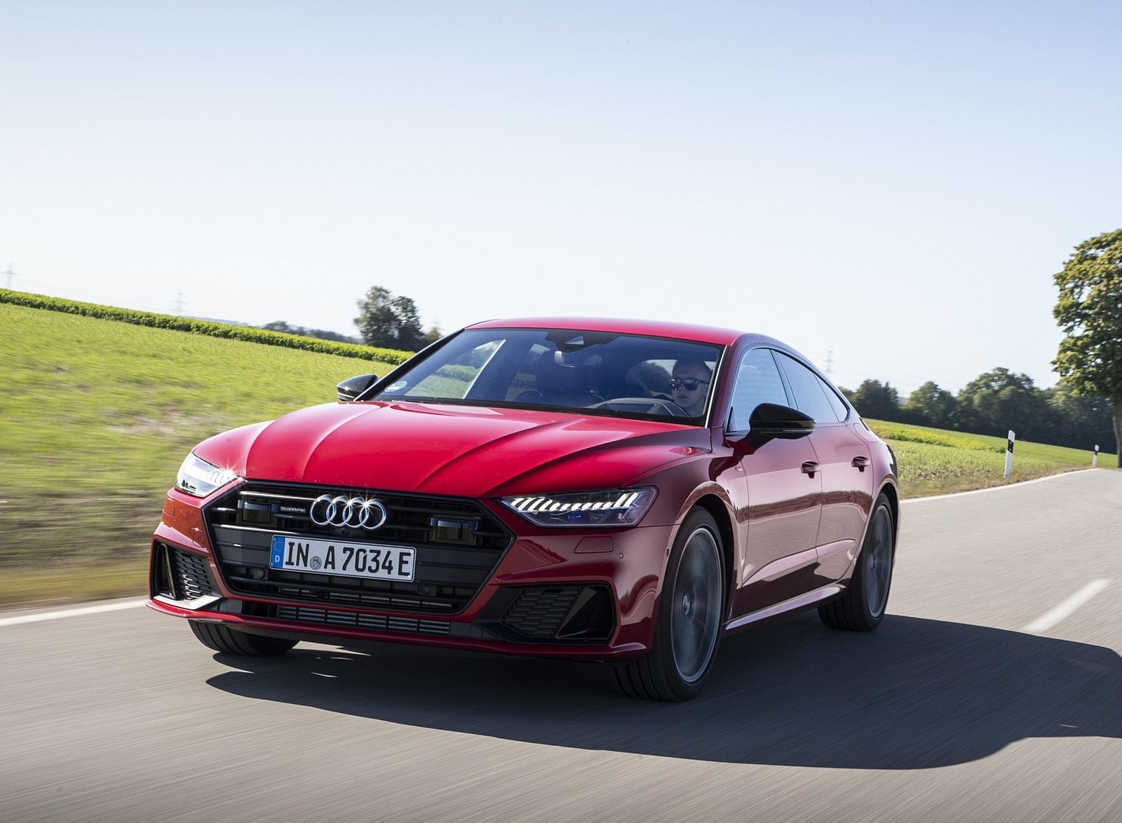 2020 Audi A7 Sportback 55 TFSI e quattro Plug-In Hybrid (Color: Tango Red) Front Three-Quarter Wallpapers (1). Download Wallpaper