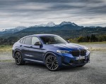 2022 BMW X4 M Competition (Color: Marina Bay Blue Metallic) Front Three-Quarter Wallpapers 150x120