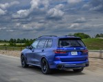 2023 BMW X7 M60i xDrive (Color: Frozen Marina Bay Blue; US-Spec) Rear Three-Quarter Wallpapers 150x120